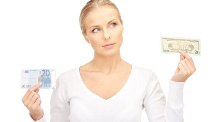 Traveler choosing between euros and US dollars