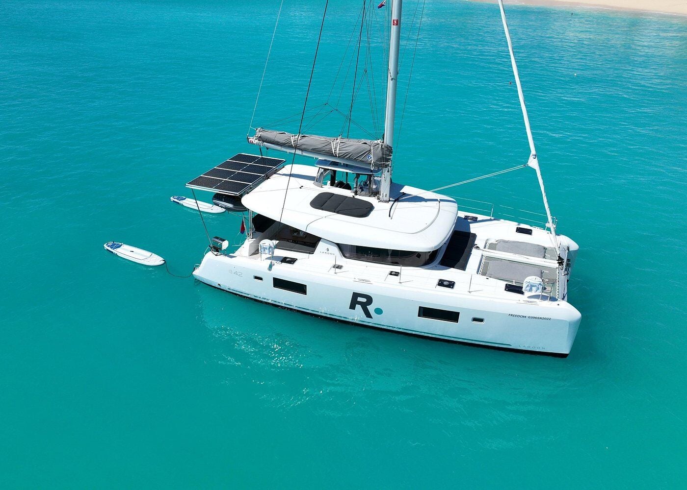 Catamaran anchored in clear turquoise water off St Maarten